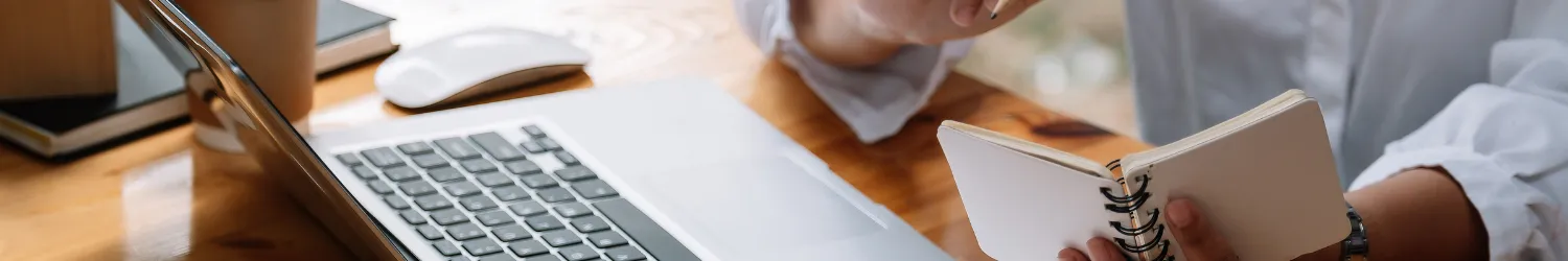 Person sitting at a desk working on a computer.